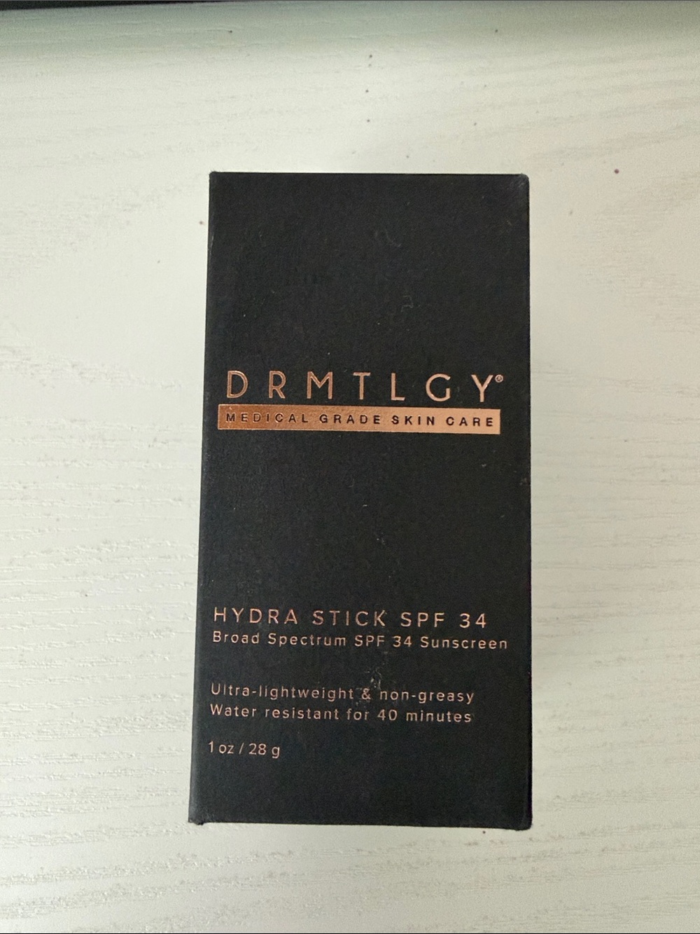 DRMTLGY Hydra Stick SPF 34 — Black Sunscreen Stick